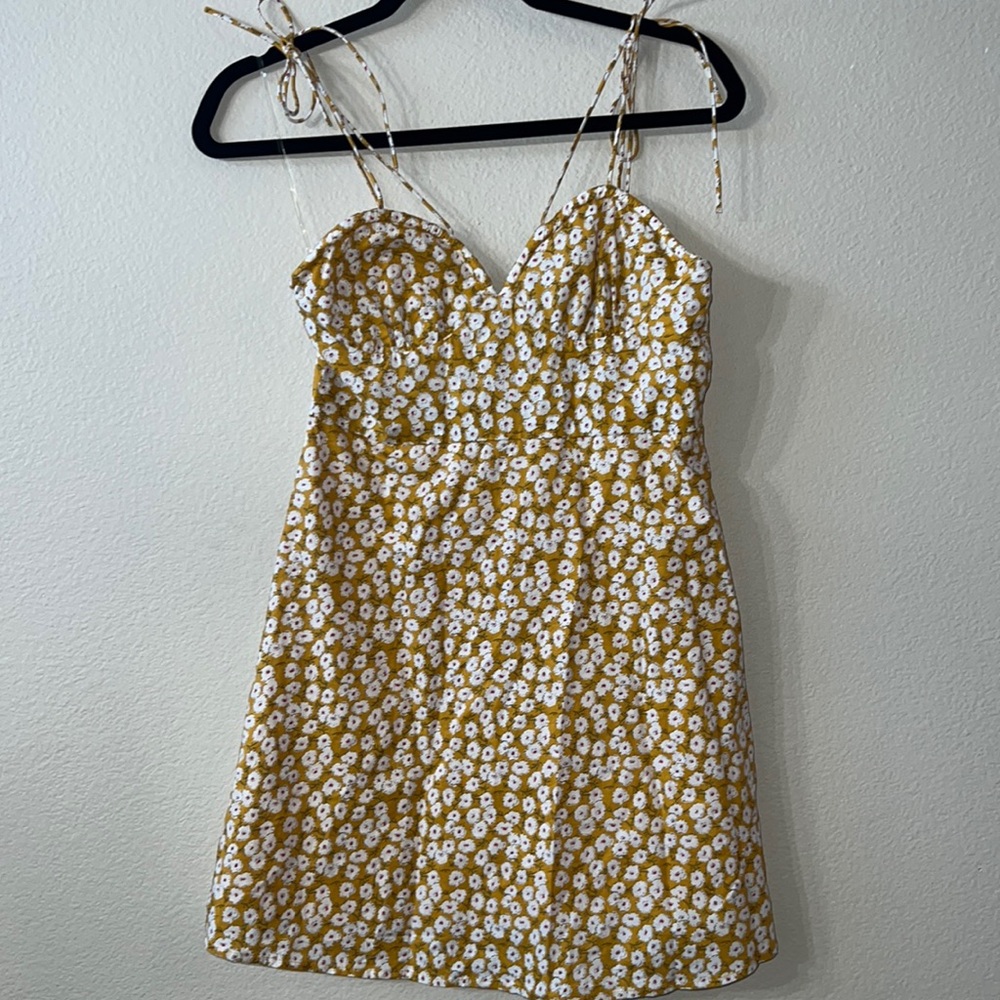 Fashion Nova mustard colored dress with white floral print. Size medium